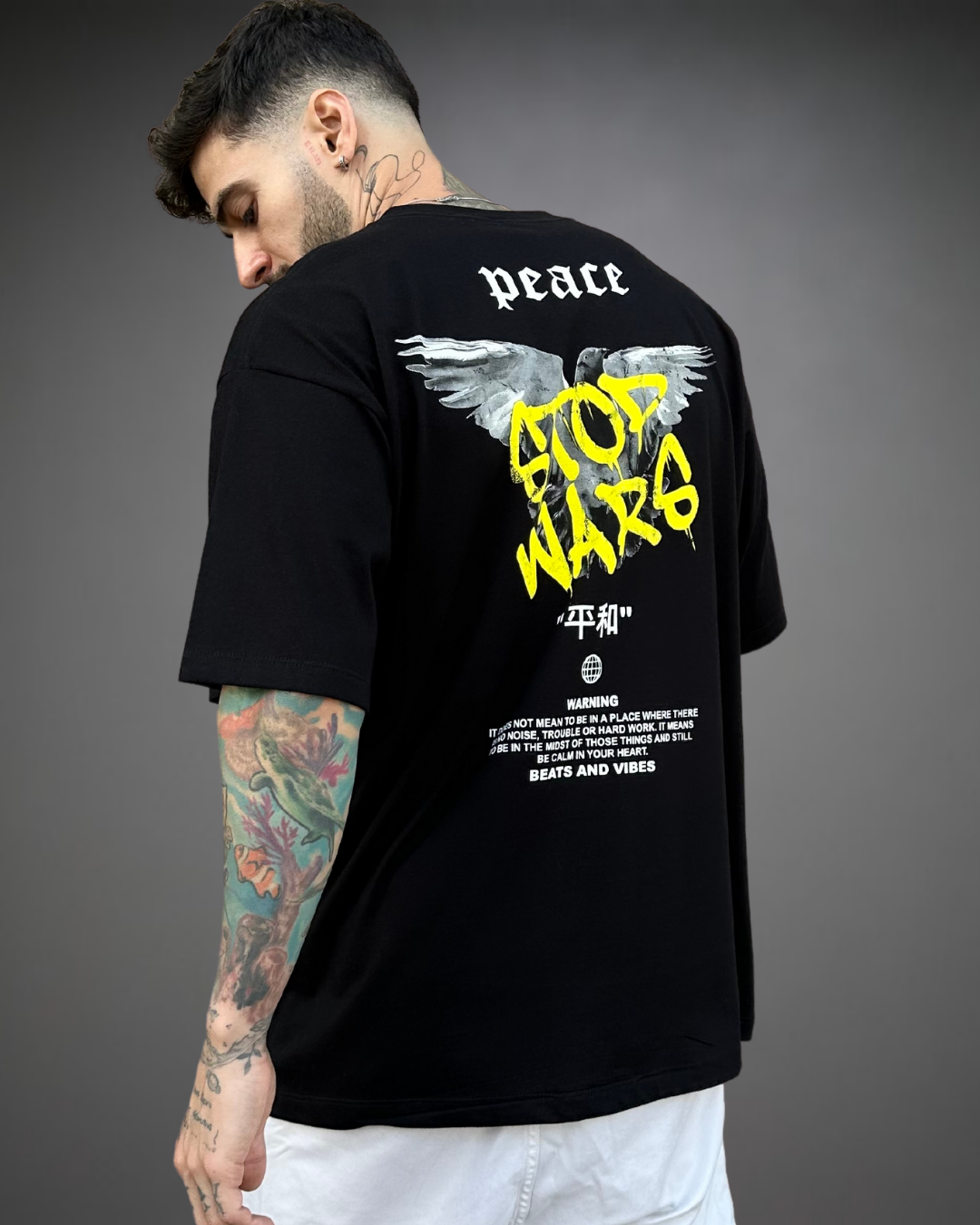 Polo Hombre Oversize Stop Wars - Negro