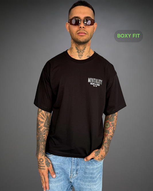 Polo Hombre Boxy Fit Lion Mentality - Negro